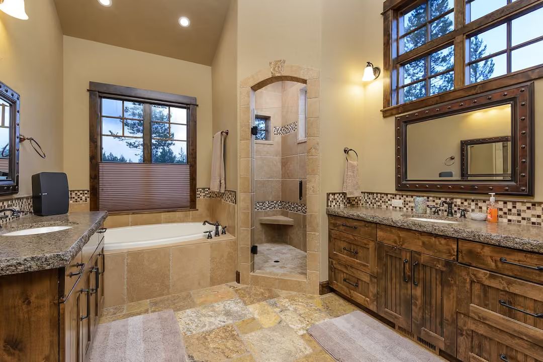 Travertine Floors and an Arched Shower Entry That Justify the Square Footage