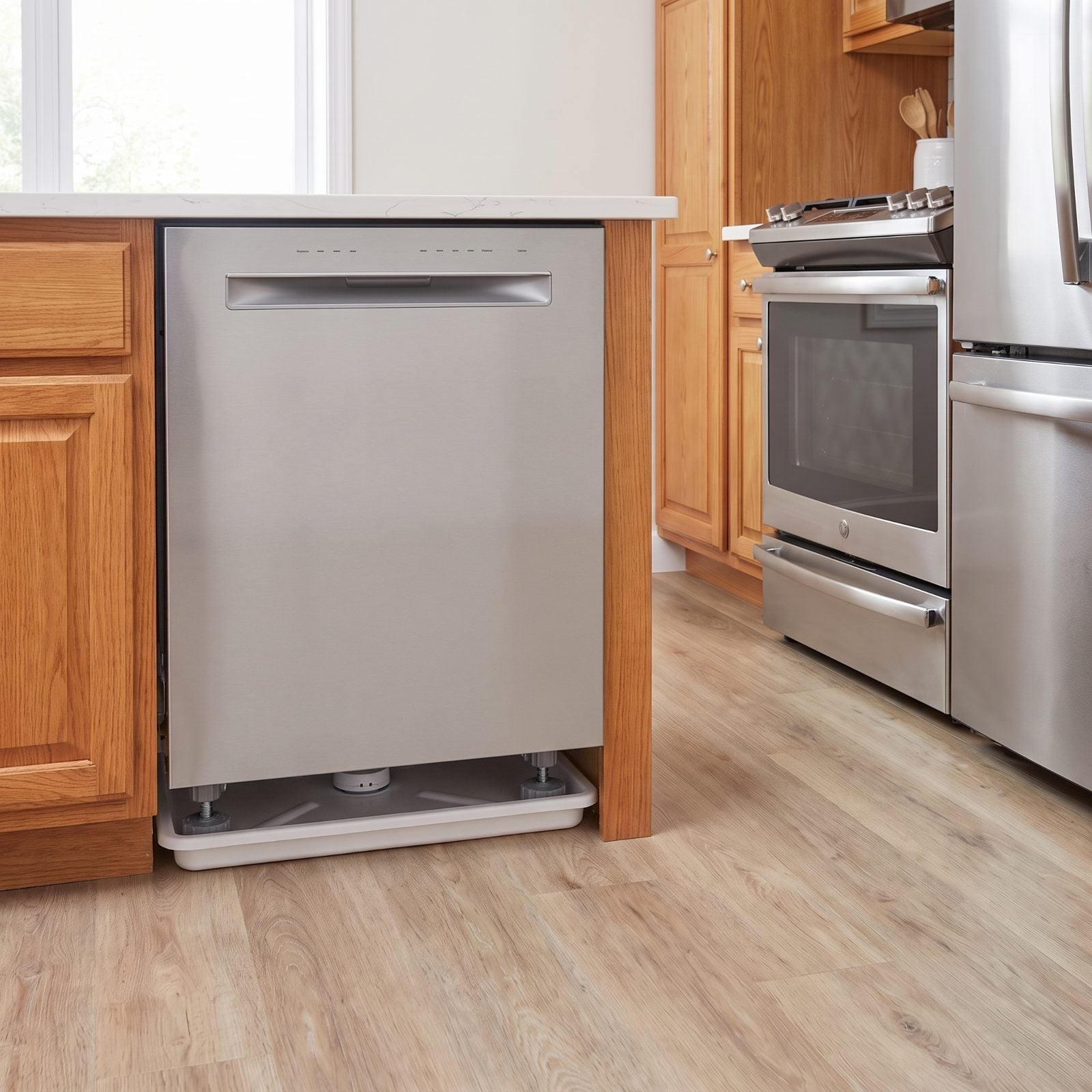 A Dishwasher Leak Tray Paired With a Water-Sensor Puck