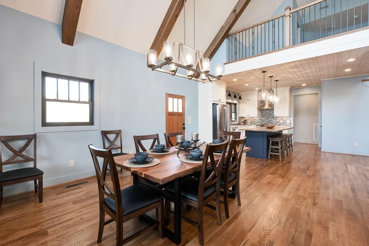 Vaulted Ceilings and a Navy Island Pull the Dining Room Into the Kitchen's Orbit