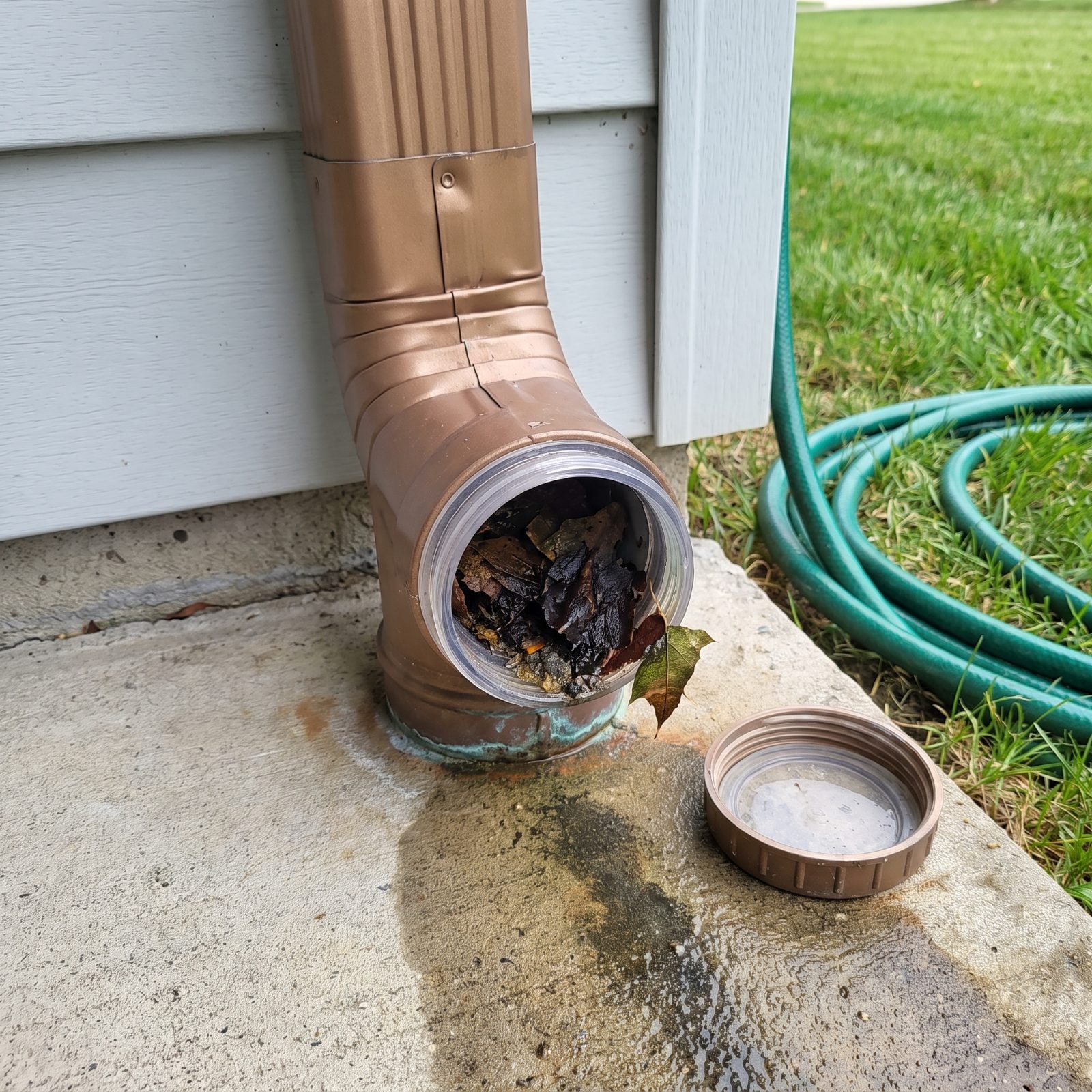 A Downspout Cleanout Port That Makes Clogs Easier to Reach