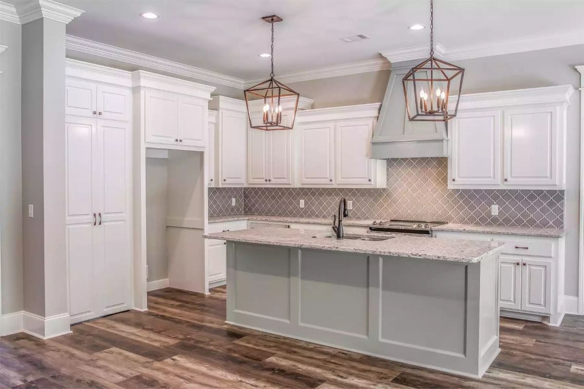 Copper Lanterns Over a Gray Island That Pulls the Whole Kitchen Together