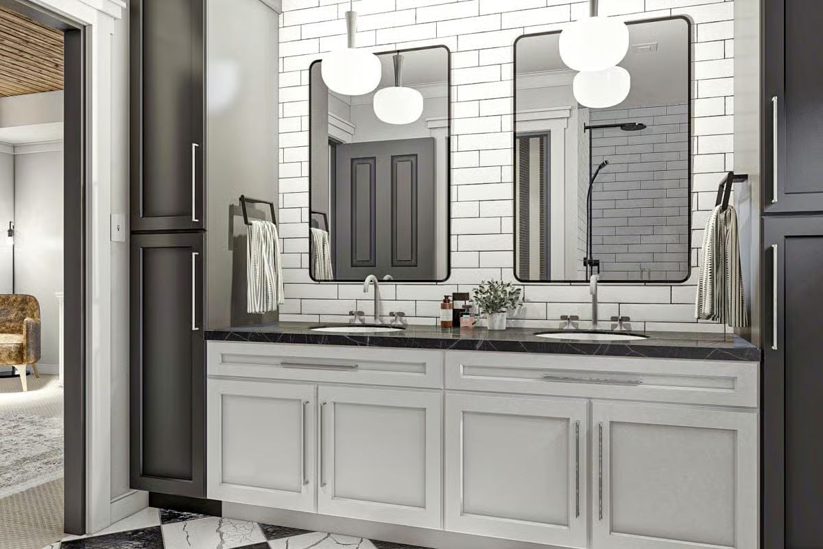 Double Vanity With Dark Marble and Globe Pendants That Pull Their Weight
