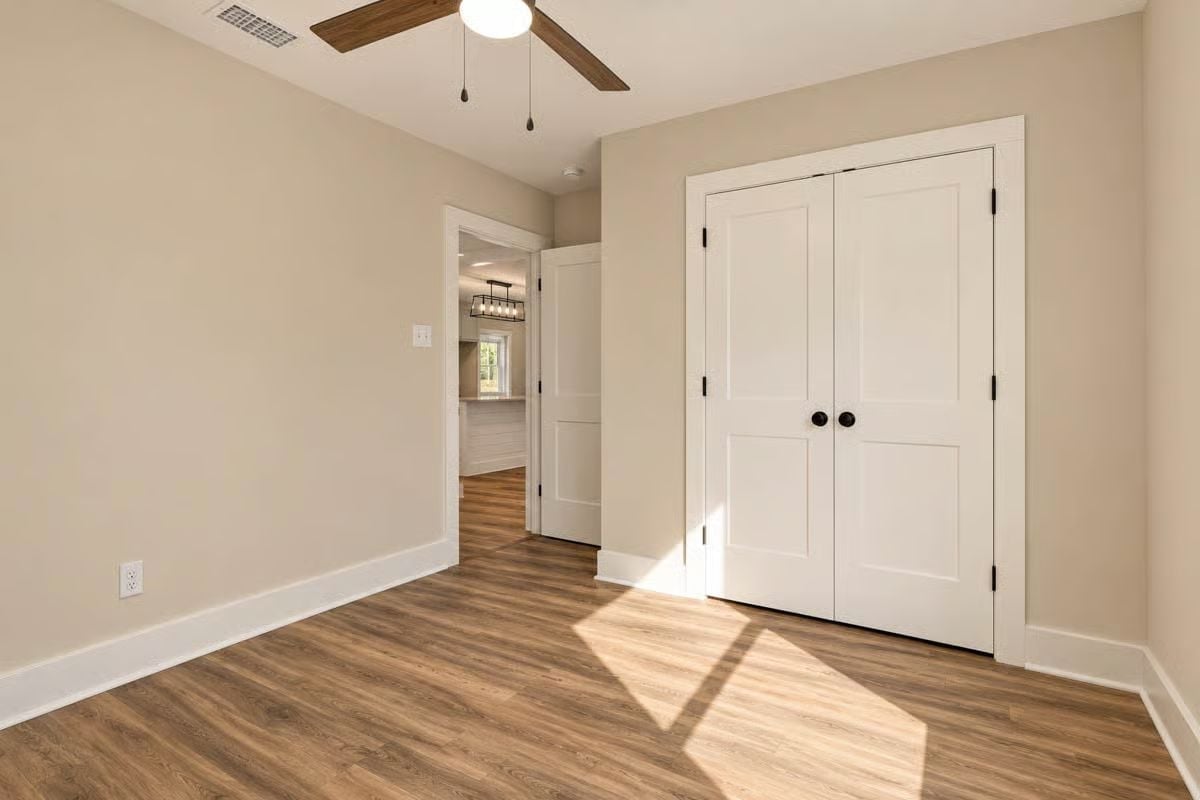 Double Closet Doors, Black Pulls, and Sunlight Doing Its Job