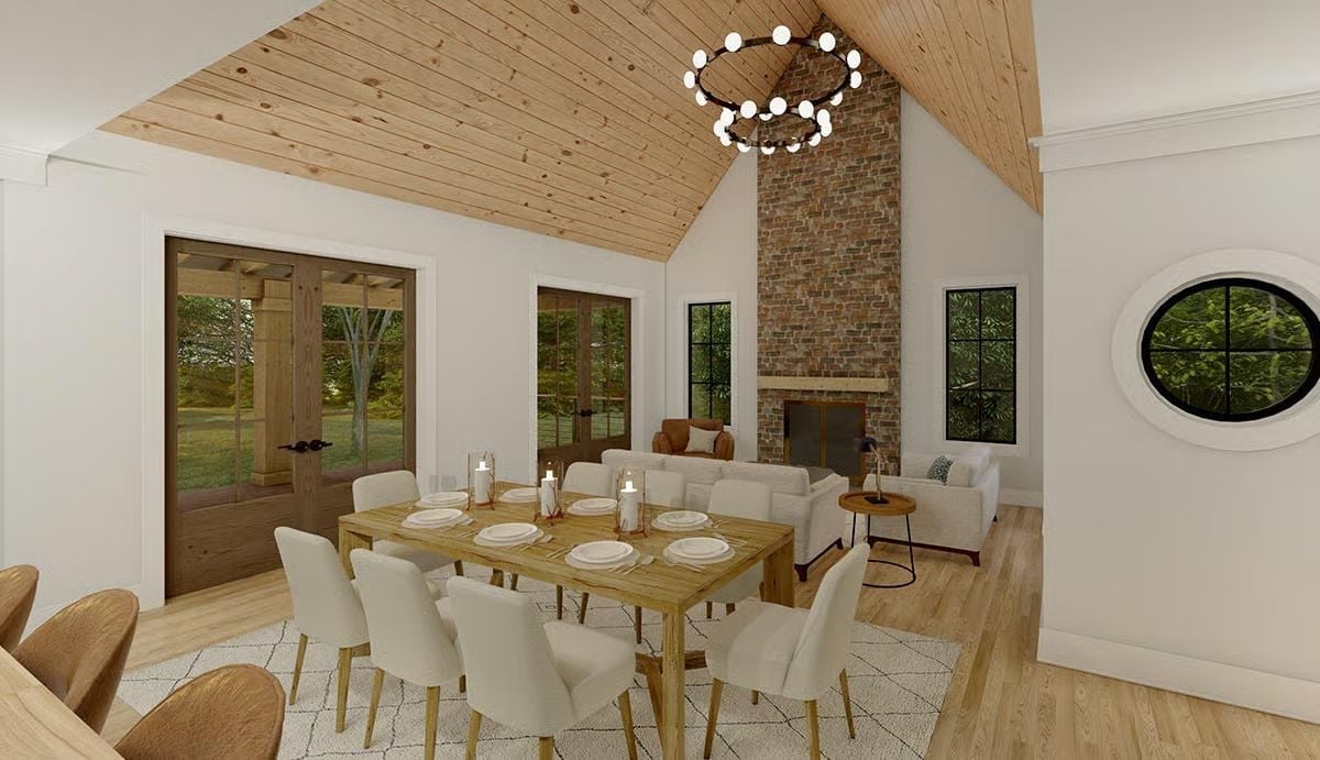 Vaulted Dining Room With a Brick Chimney That Commands the Wall