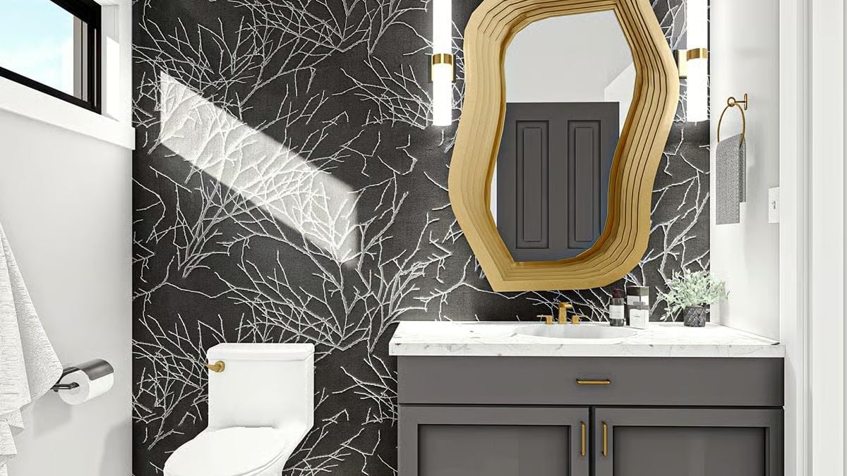 Gold-Framed Mirror, Dark Botanical Wallpaper, and Hardware That Ties It Together