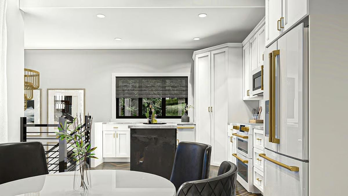 Gold Hardware on White Cabinets With a Dark Island That Pulls Its Weight