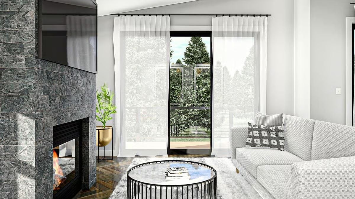 Sheer Curtains, Stone Fire Surround, and a Door That Opens to the Trees