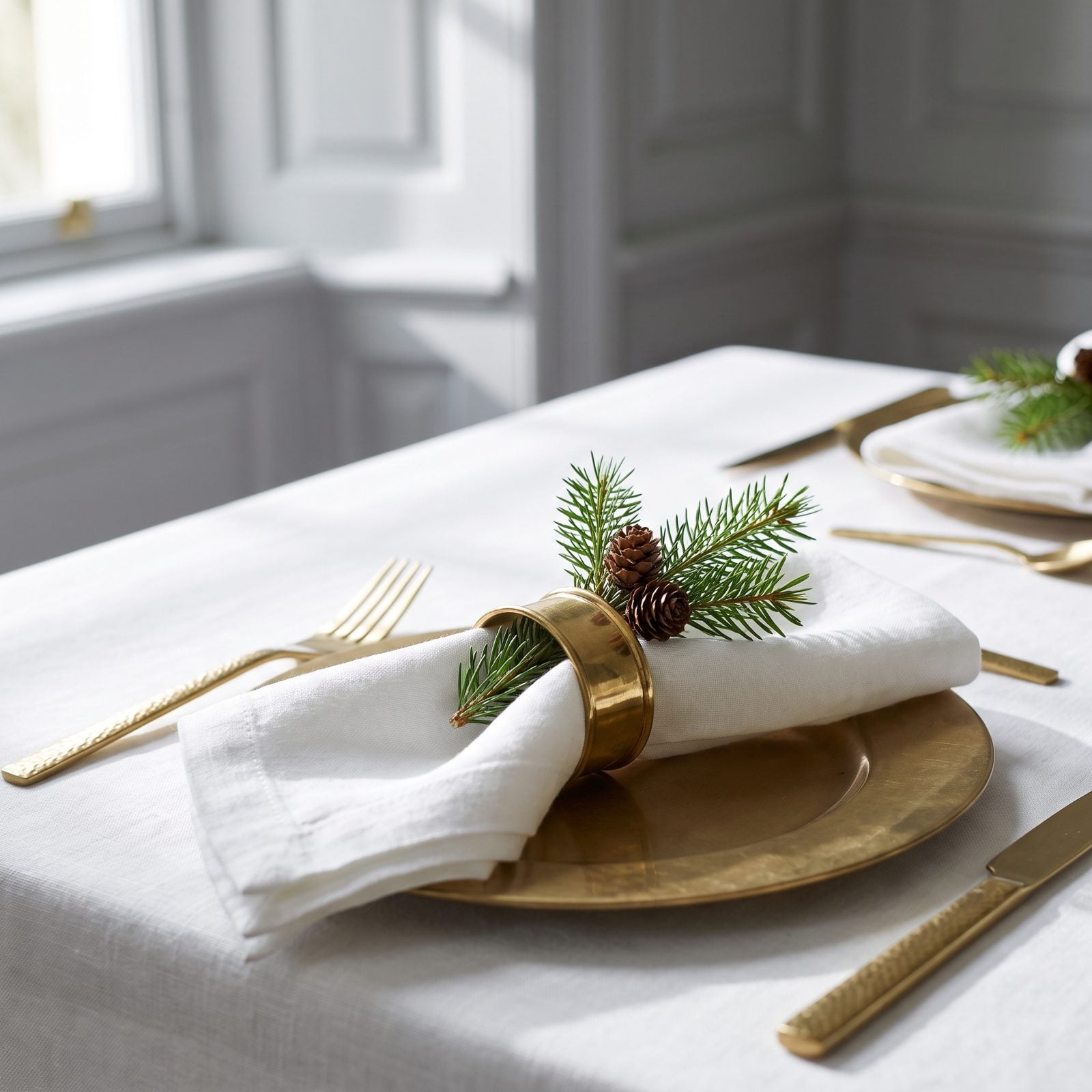 An Evergreen Sprig Tucked Beneath a Napkin Ring