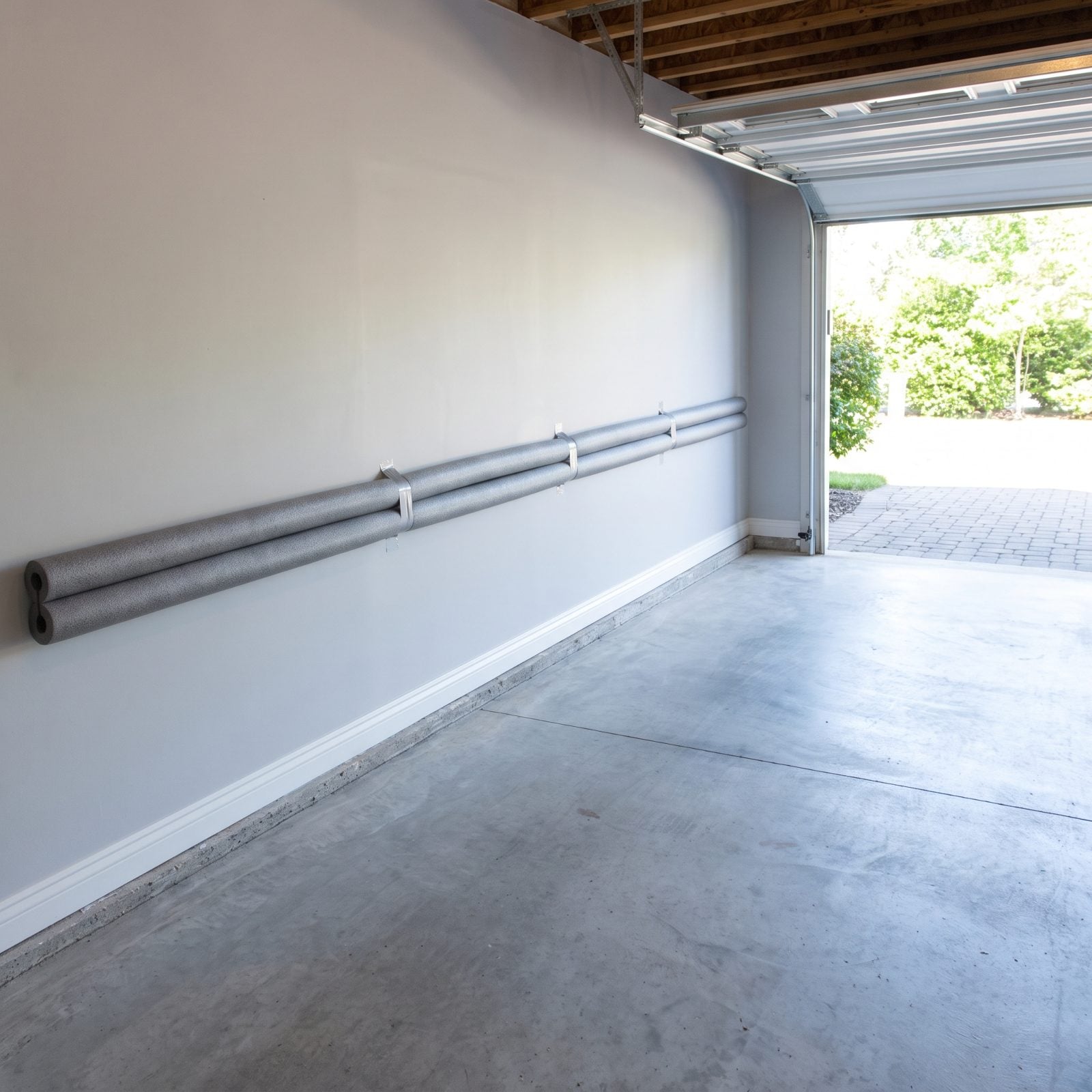 Foam Pipe Insulation on the Garage Wall Saves Your Car Doors