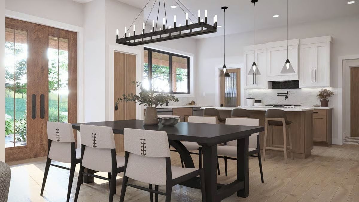 Dark Table, Candle-Style Chandelier, and a Kitchen That Never Feels Far Away