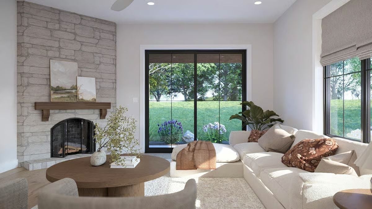 Stone Fireplace, Round Coffee Table, and a View That Does All the Work