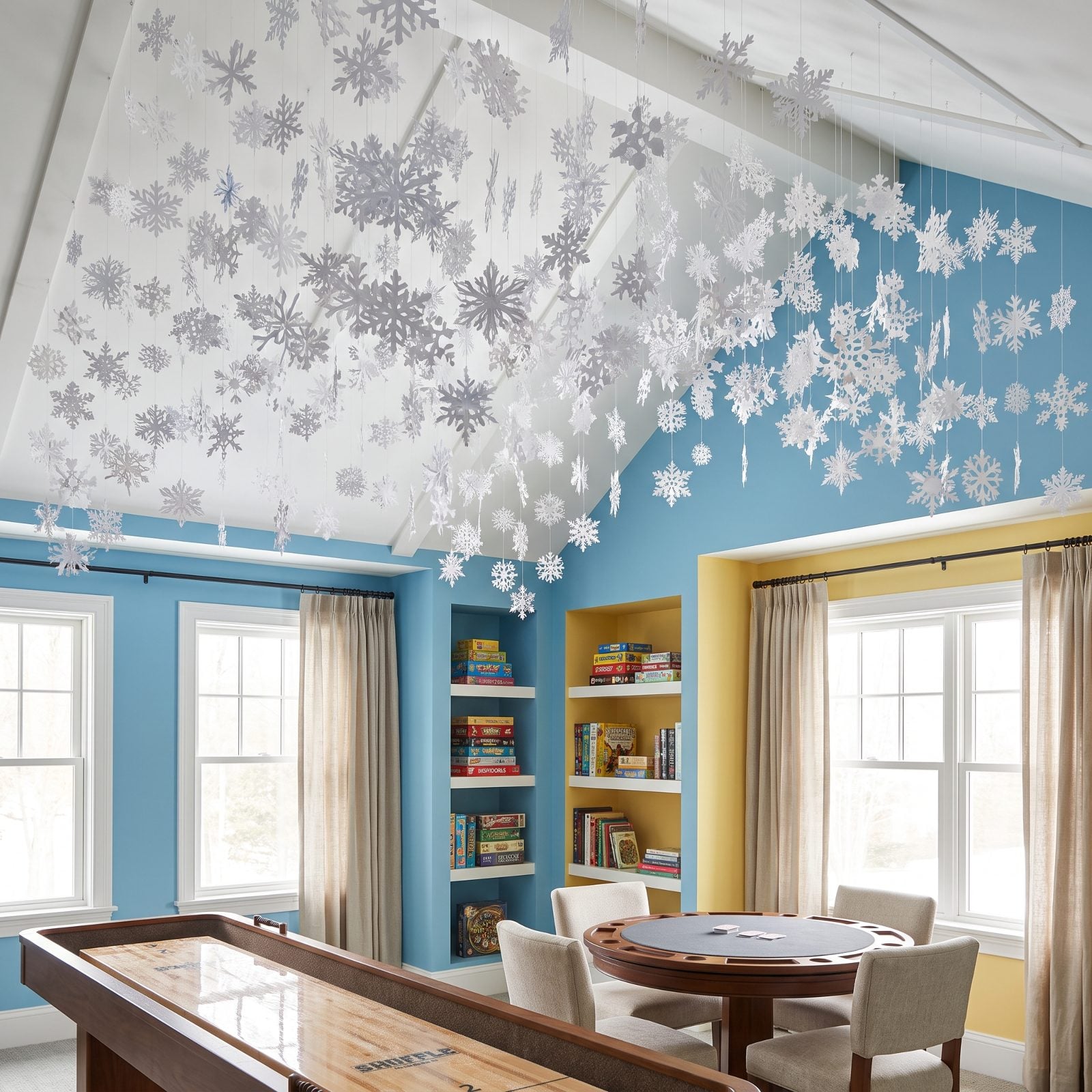 A Game Room Under a Ceiling of Hanging Snowflakes