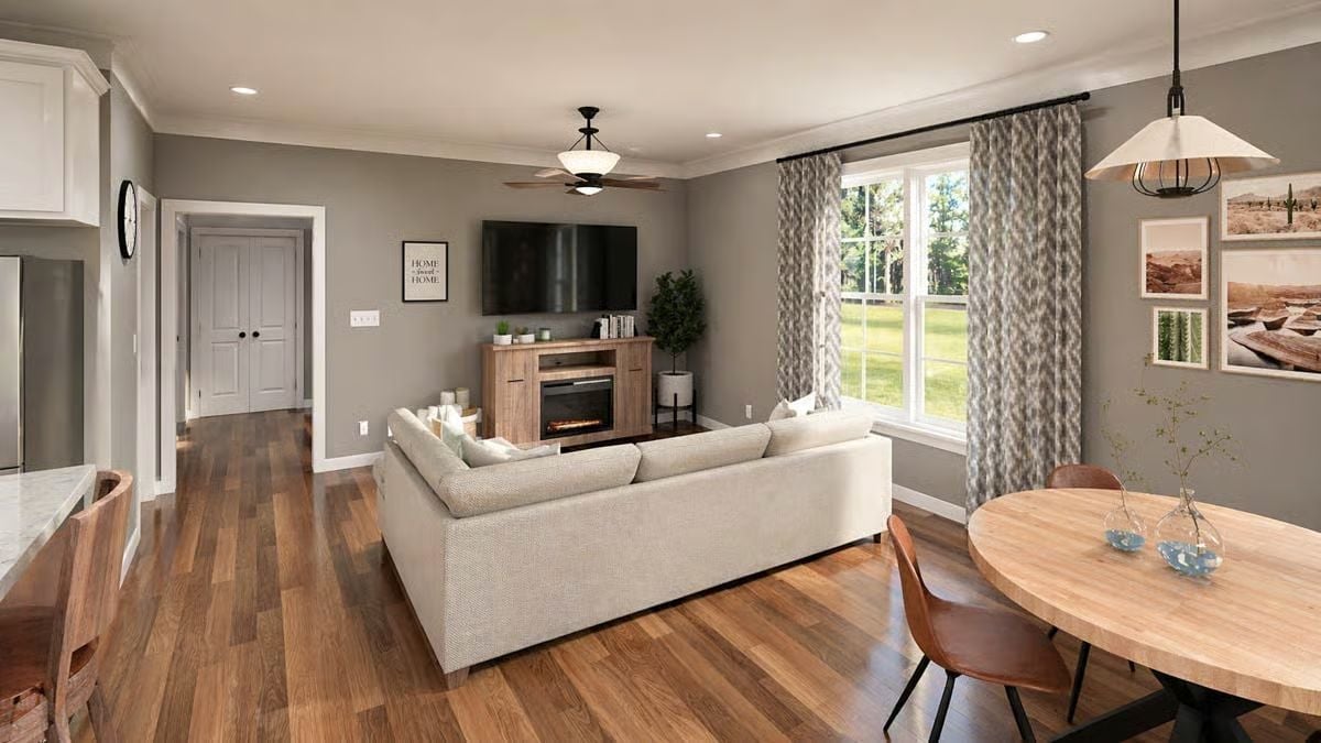 Warm Wood Floors and a Corner Sofa Built for Staying In
