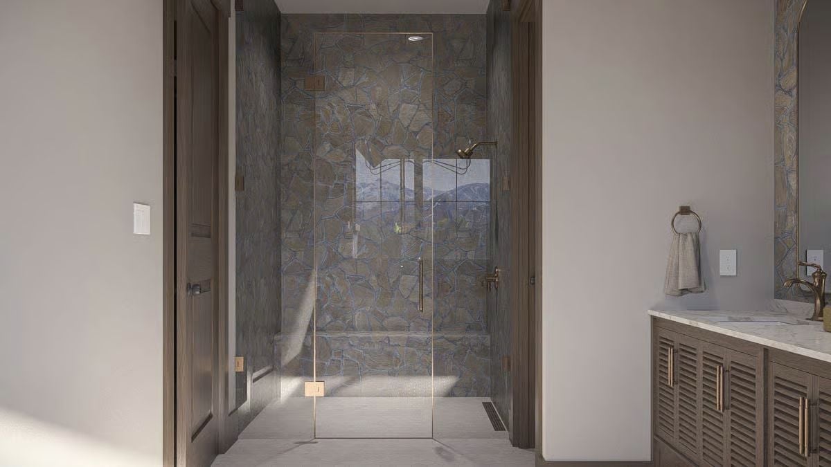 Brushed Gold Hardware, Stacked Stone Walls, and a Shower That Goes Somewhere