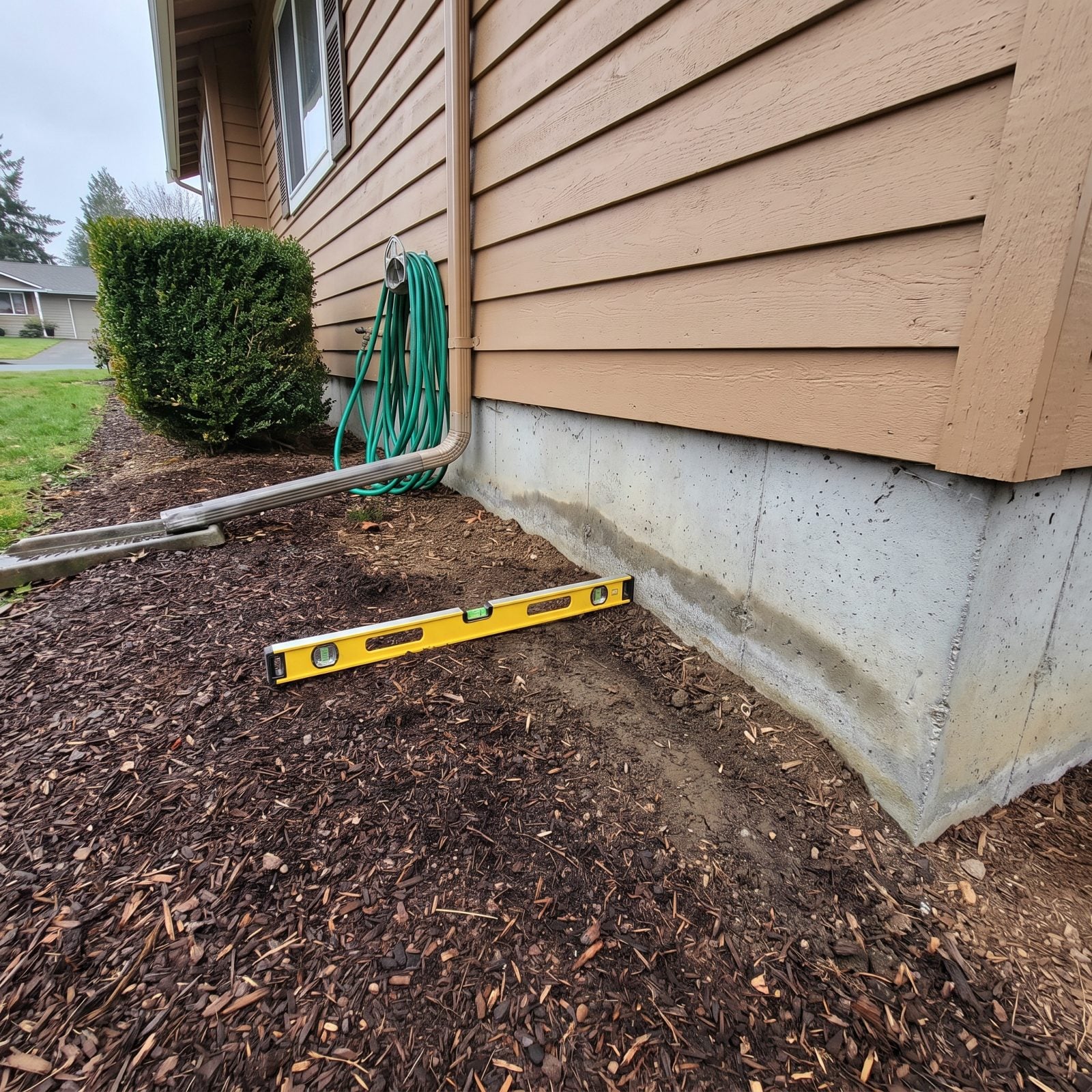 Ground Sloping Toward the Foundation