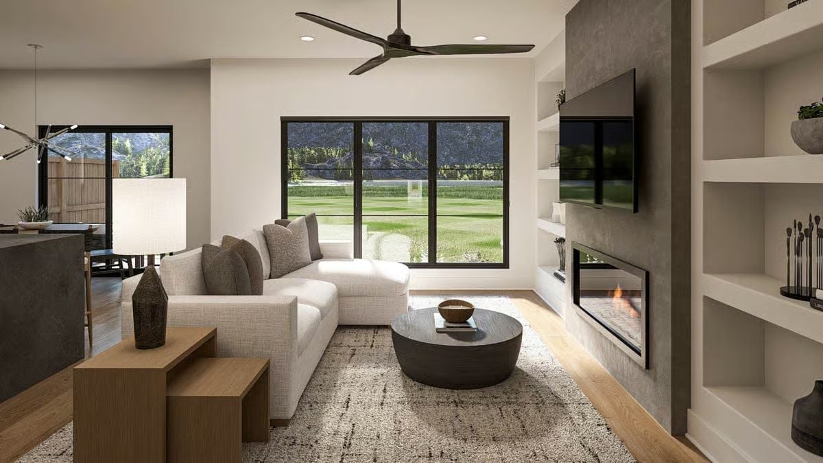 Concrete Fireplace Wall, Round Coffee Table, and Views That Do the Decorating