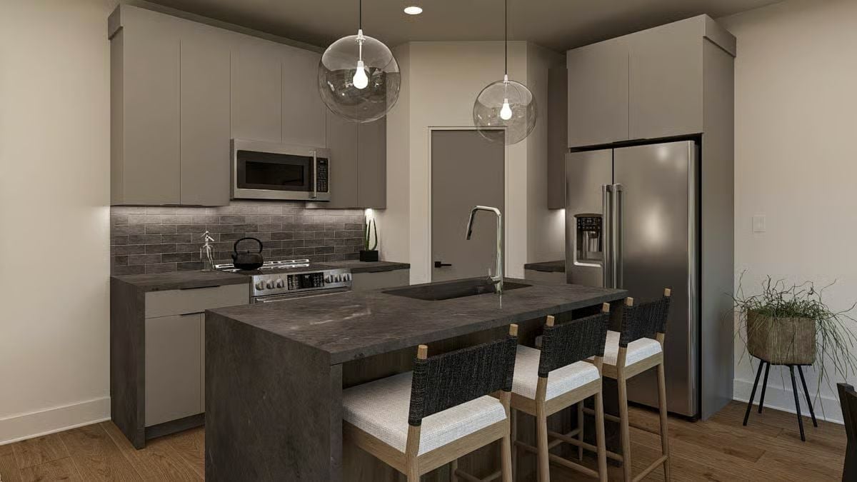 Globe Pendants and Dark Stone Counters That Mean Business