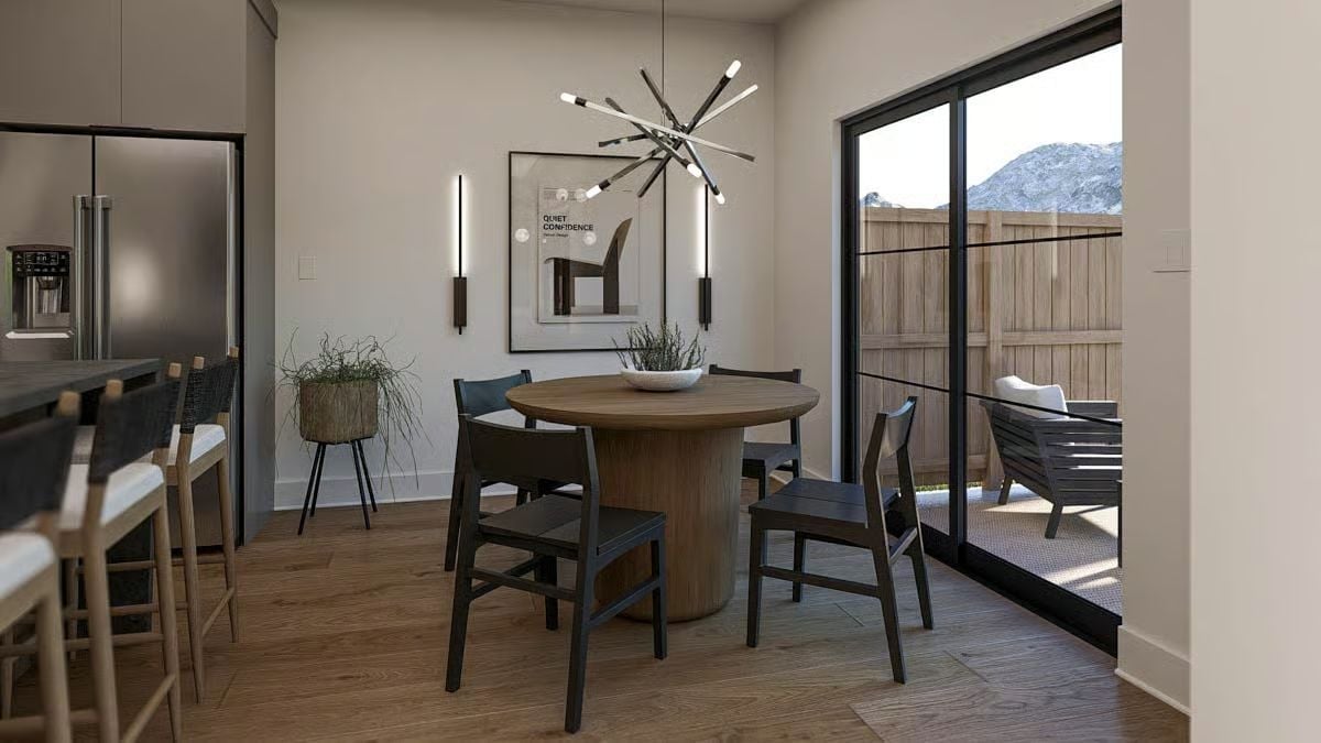 Sputnik Chandelier and a Round Pedestal Table That Earn Their Keep