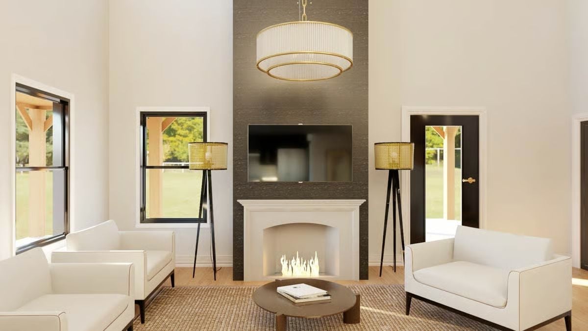 Gold Tripod Lamps Flanking a Fireplace That Actually Earns the Wall Space