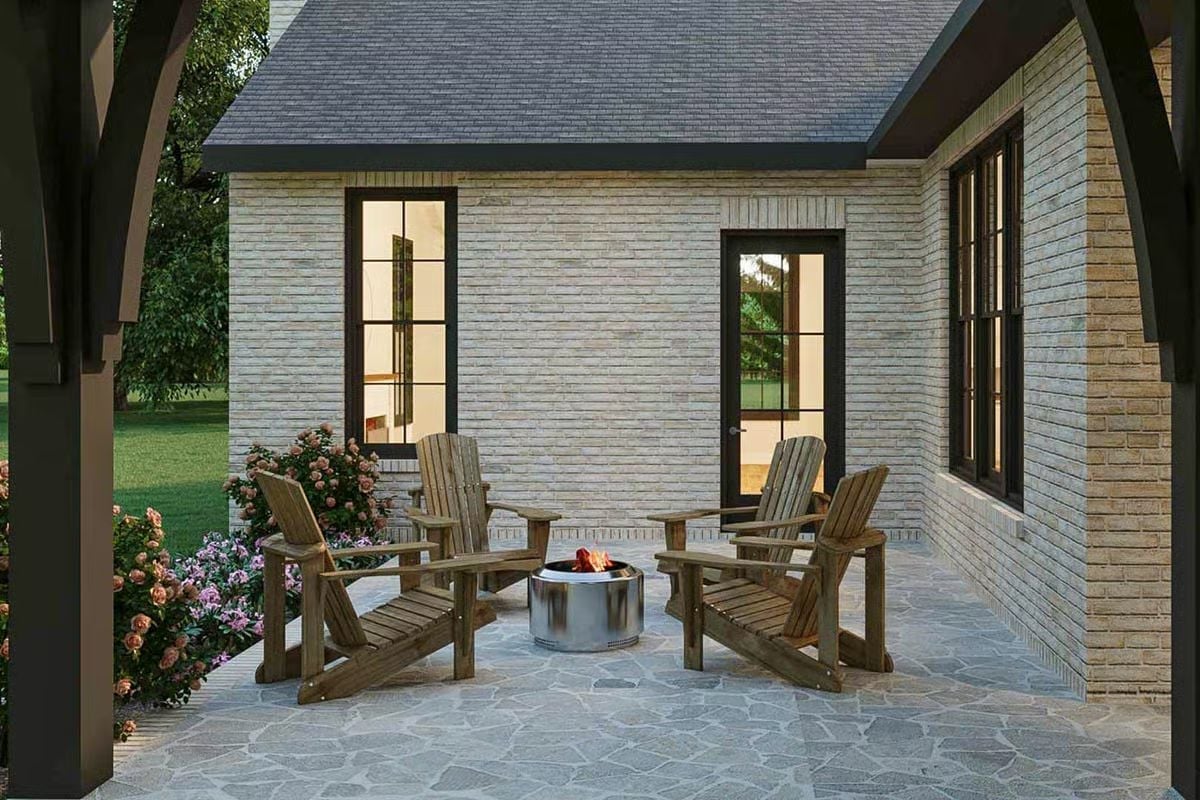 Flagstone, Adirondack Chairs, and a Steel Fire Pit That Earns Its Place