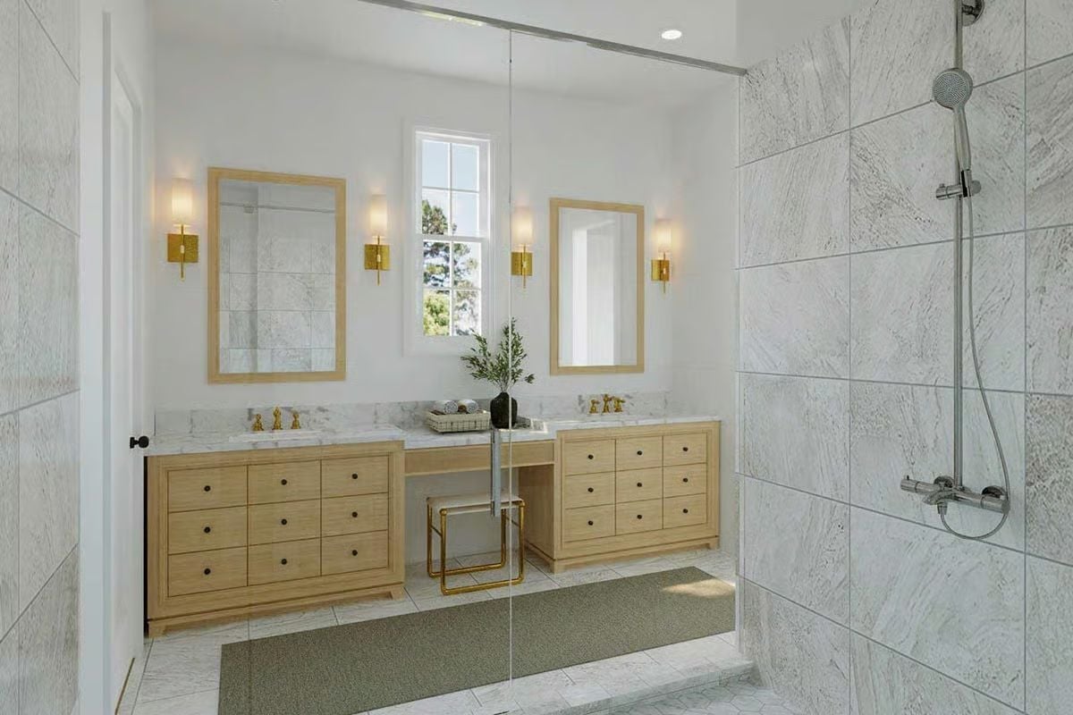 Gold Sconces, Marble Slabs, and a Vanity Bench That Pulls It Together