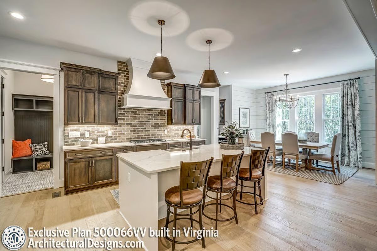 Brick Backsplash and Bronze Pendants Doing the Heavy Lifting in This Kitchen