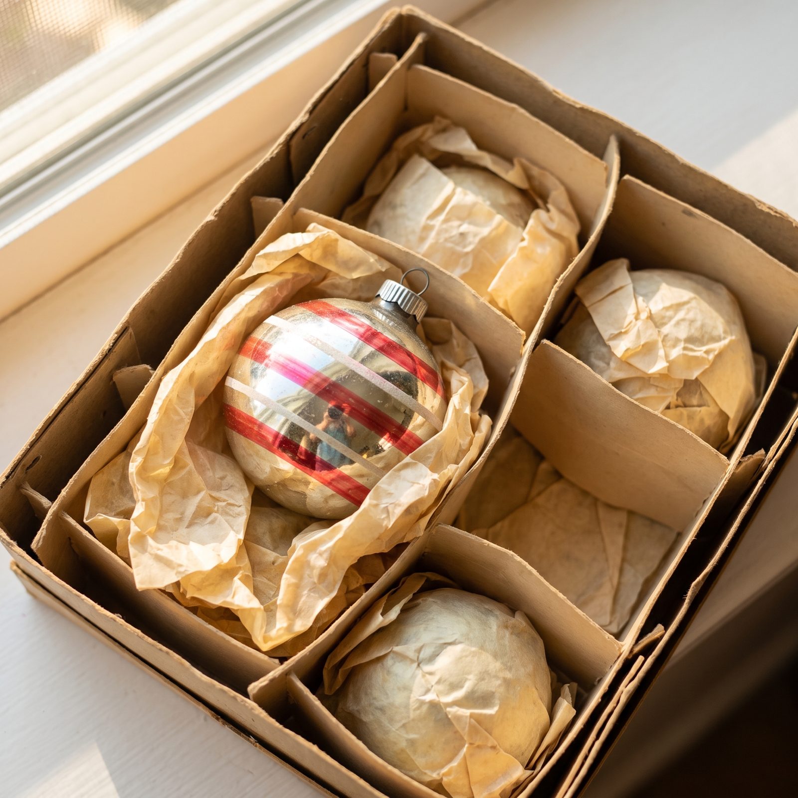 Heavy Glass Ornaments Wrapped in Yellowed Tissue