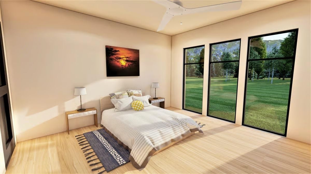 Floor-to-Ceiling Black-Frame Windows Turn a Green Lawn Into Daily Scenery