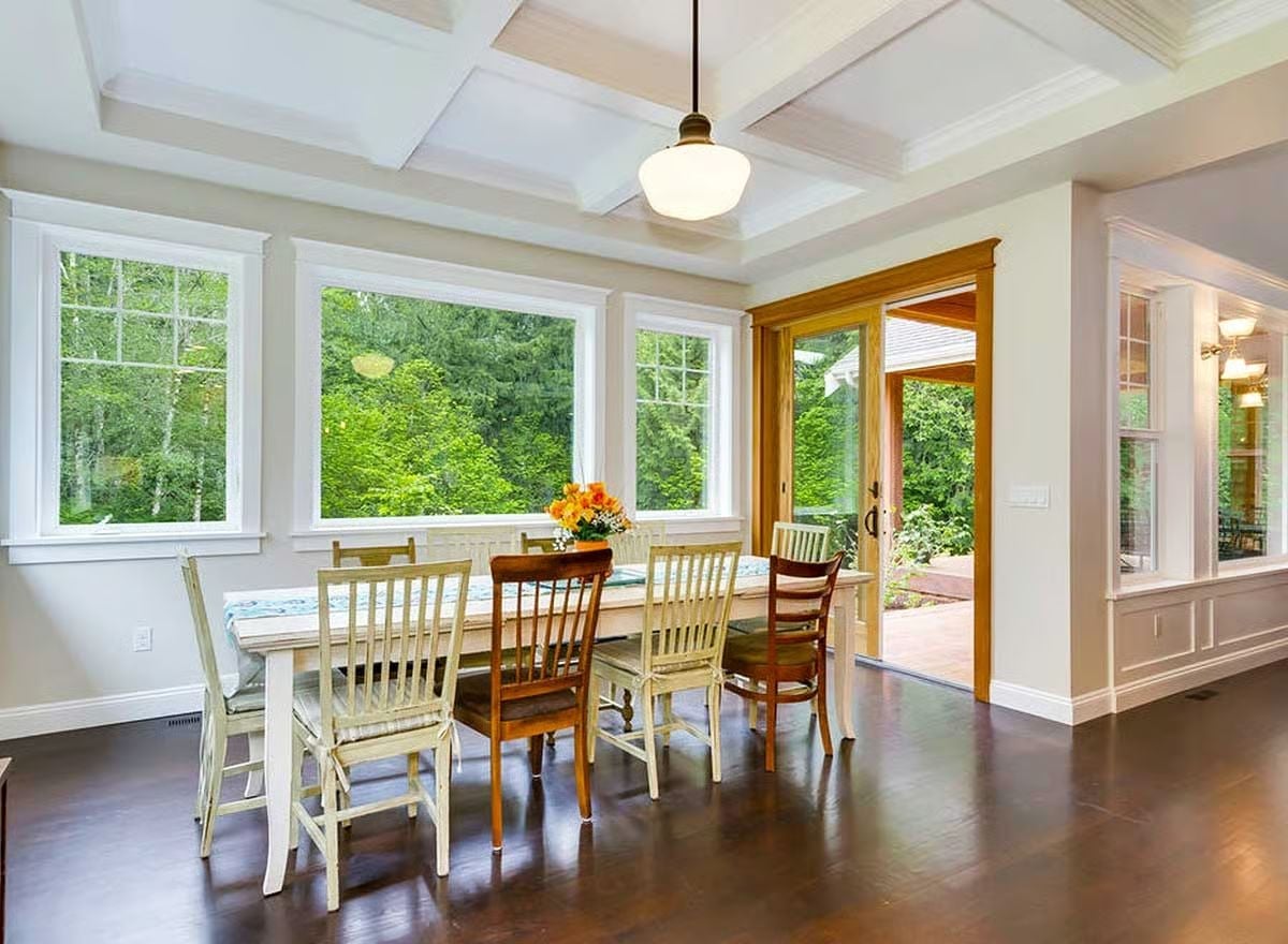 Coffered Ceiling, Mixed Chairs, and Windows That Do All the Work