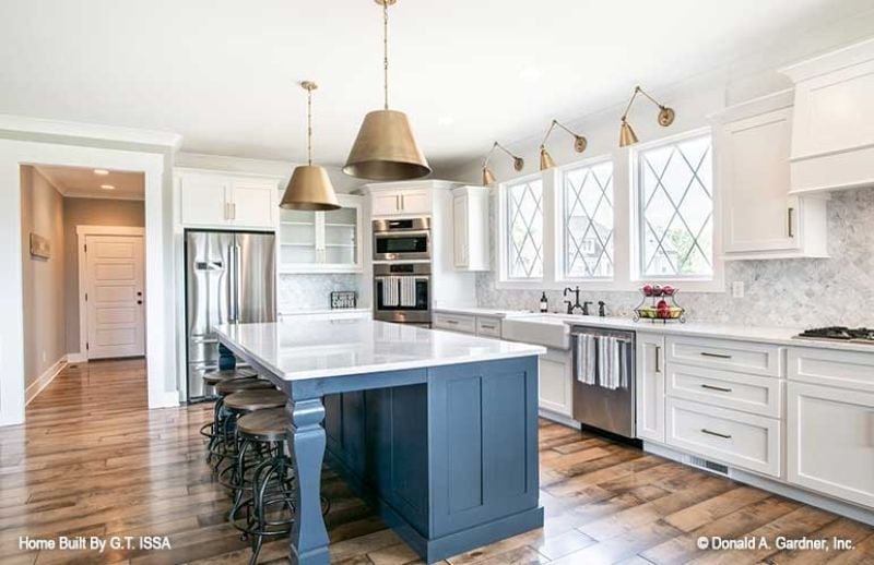 Brass Pendants and a Blue Island That Pulls the Whole Kitchen Together