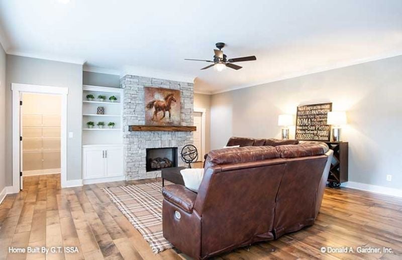Brown Leather and a Stone Fireplace That Don't Need Any Help Looking Good