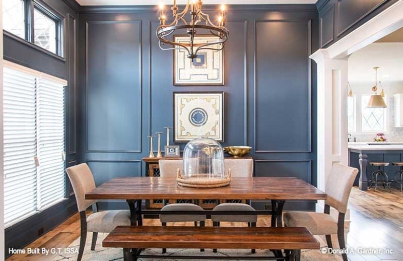Dark Navy Wainscoting and a Glass Cloche Make This Dining Room Feel Collected
