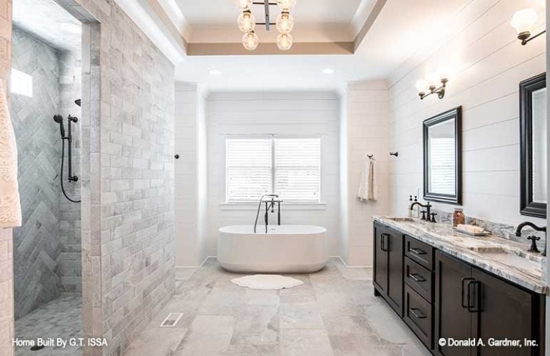 Herringbone Stone and a Soaking Tub That Make the Walk-In Shower Feel Like a Reward