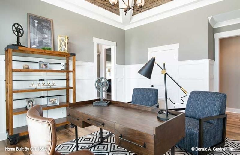 Industrial Shelving and a Leather Chair That Mean Business Without Trying Too Hard