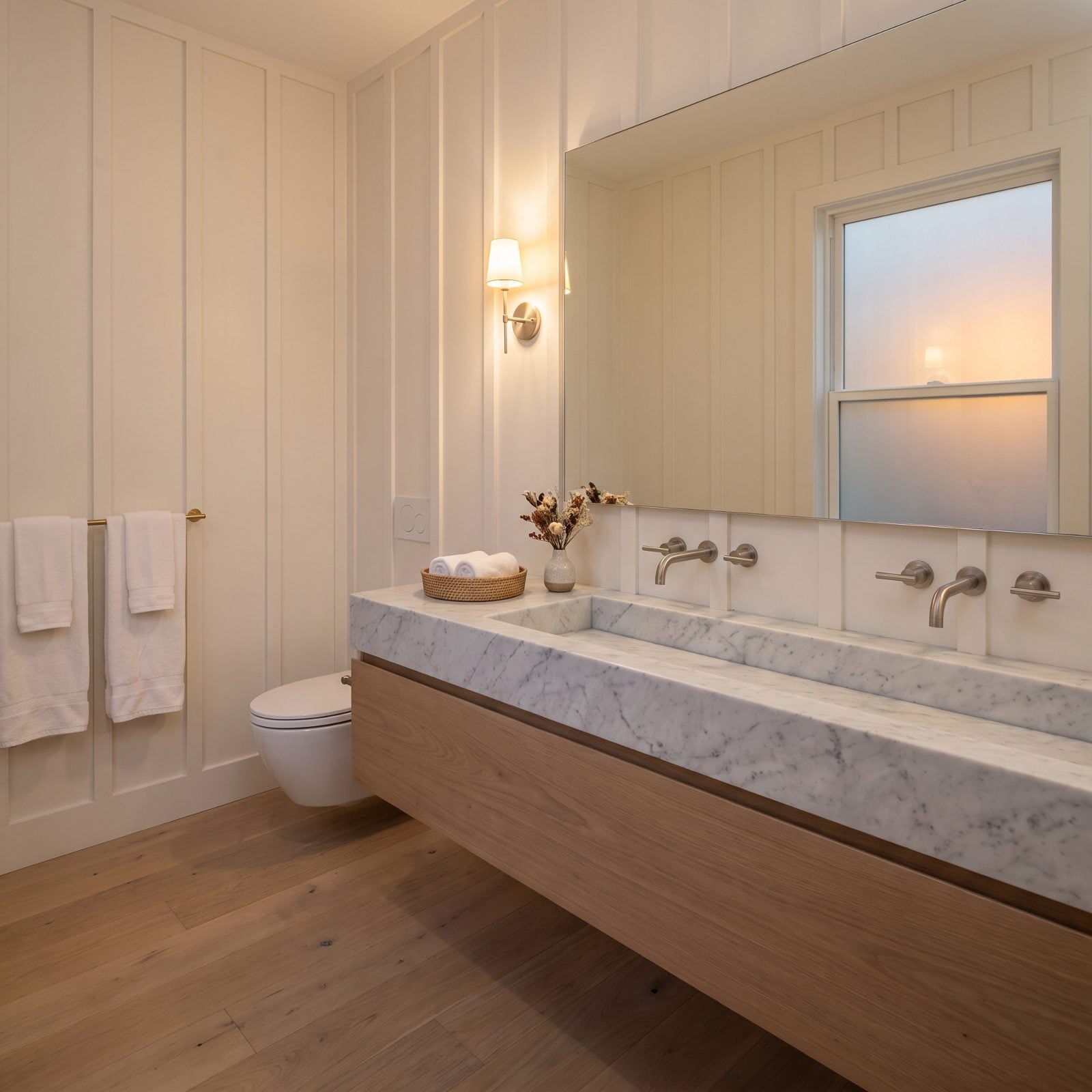 A Honed Carrara Trough on a Floating Walnut Console