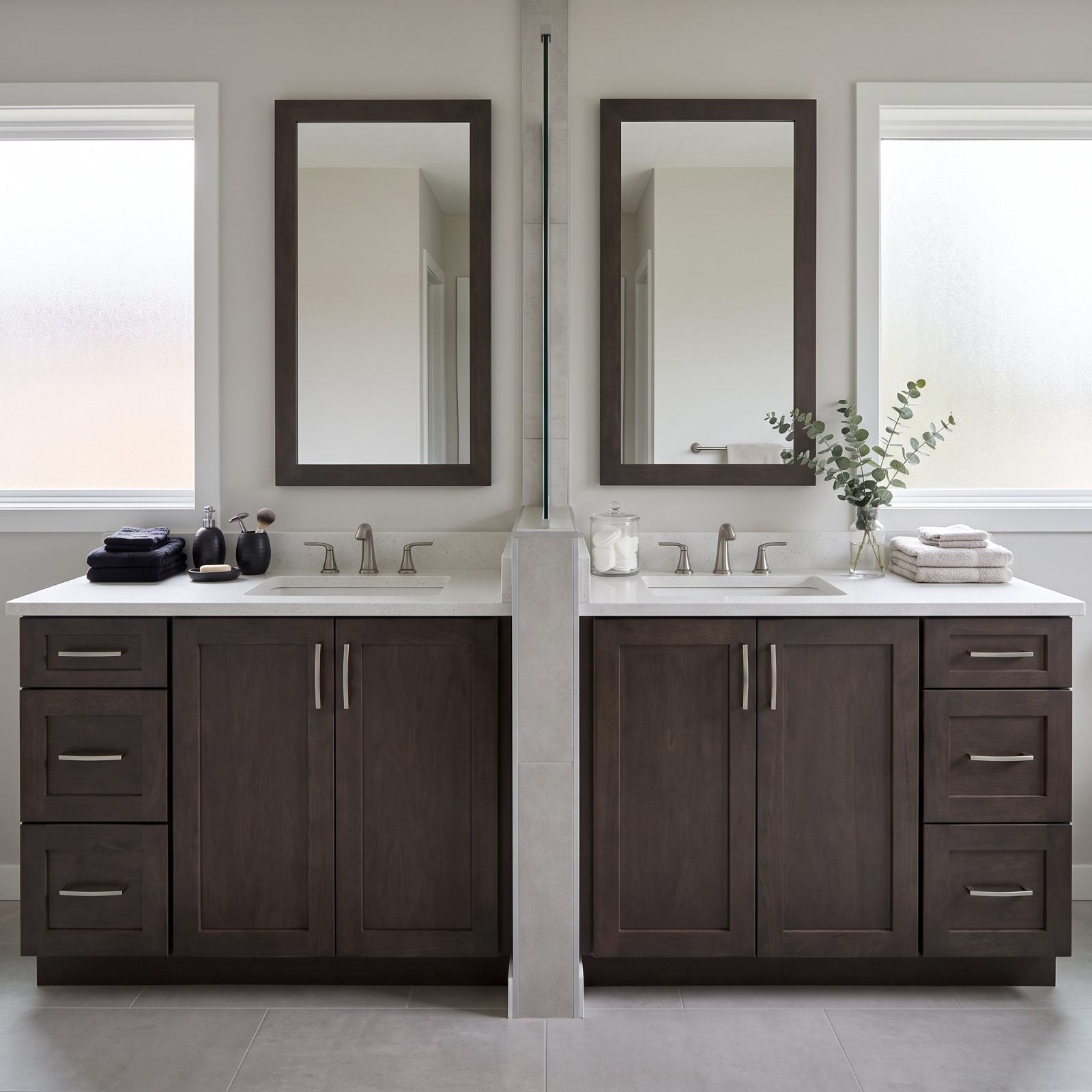 Double-sink bathroom vanity with three items neatly placed on the left side and a cluster of products on the right side.