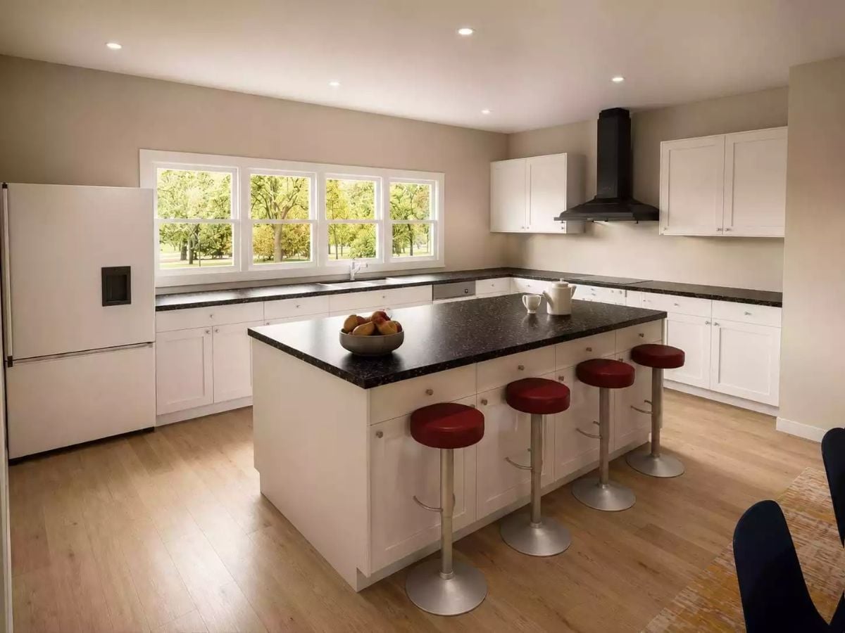 Black Granite, Red Barstools, and a Range Hood That Means Business