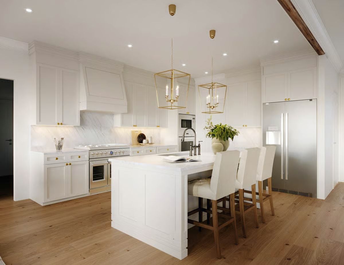 Gold Lanterns and Marble Backsplash in a Kitchen That Earns Its White