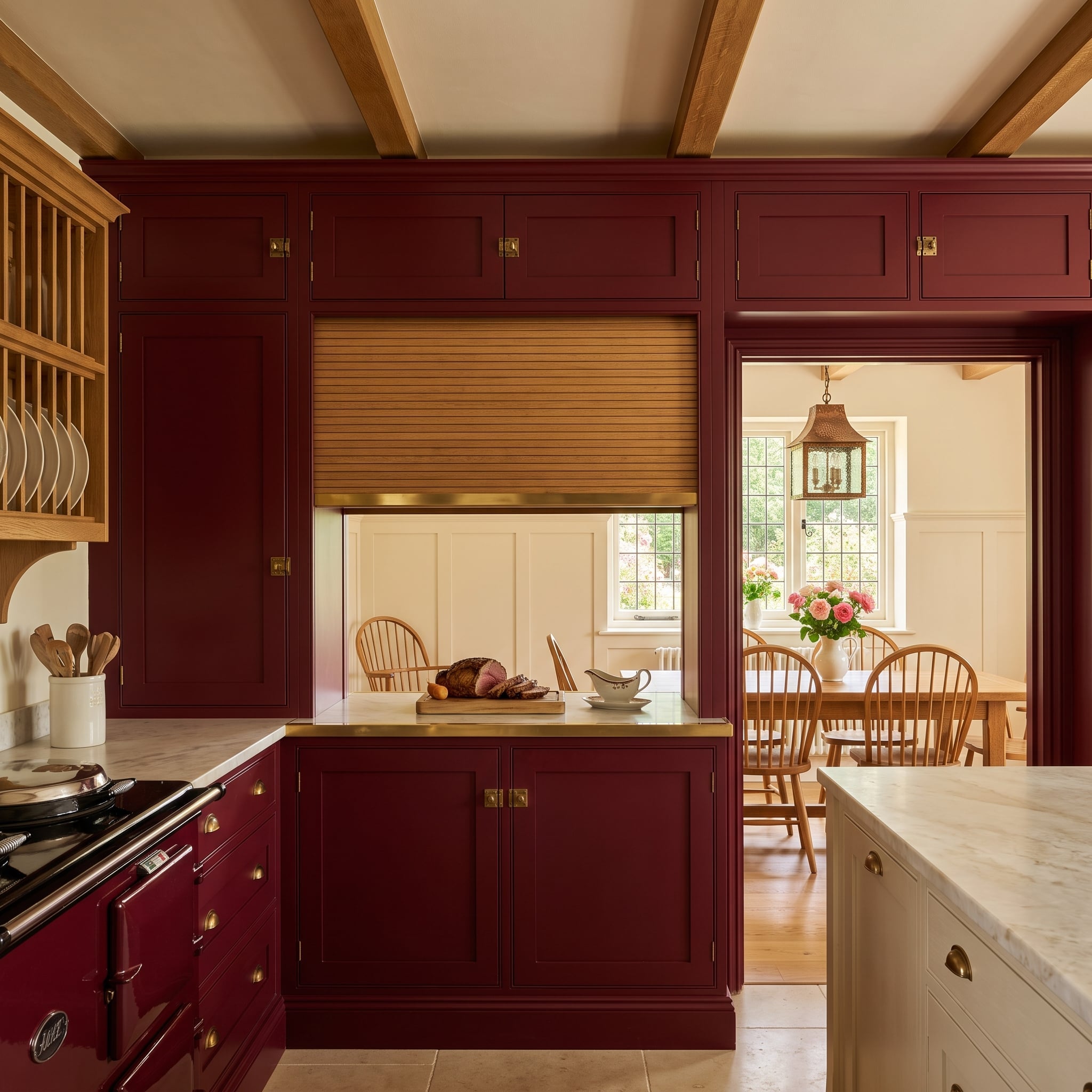 Timber tambour shutter closes a pass-through in a burgundy kitchen