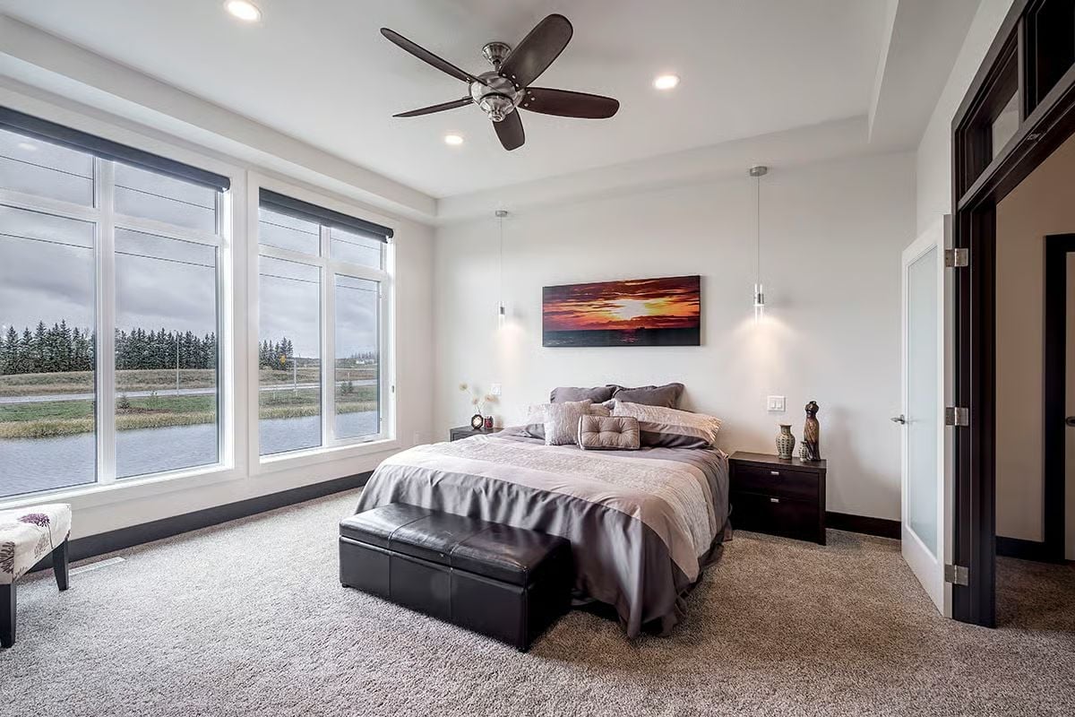 Pendant Lights Flanking a Sunset Canvas Make the Bed Wall Work Harder