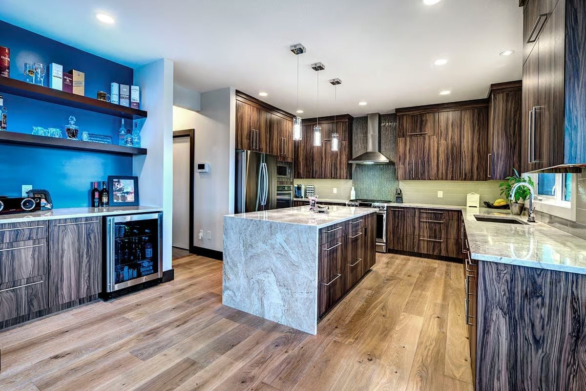 Waterfall Marble Island, Wine Fridge Built In, and a Bar Wall That Means Business