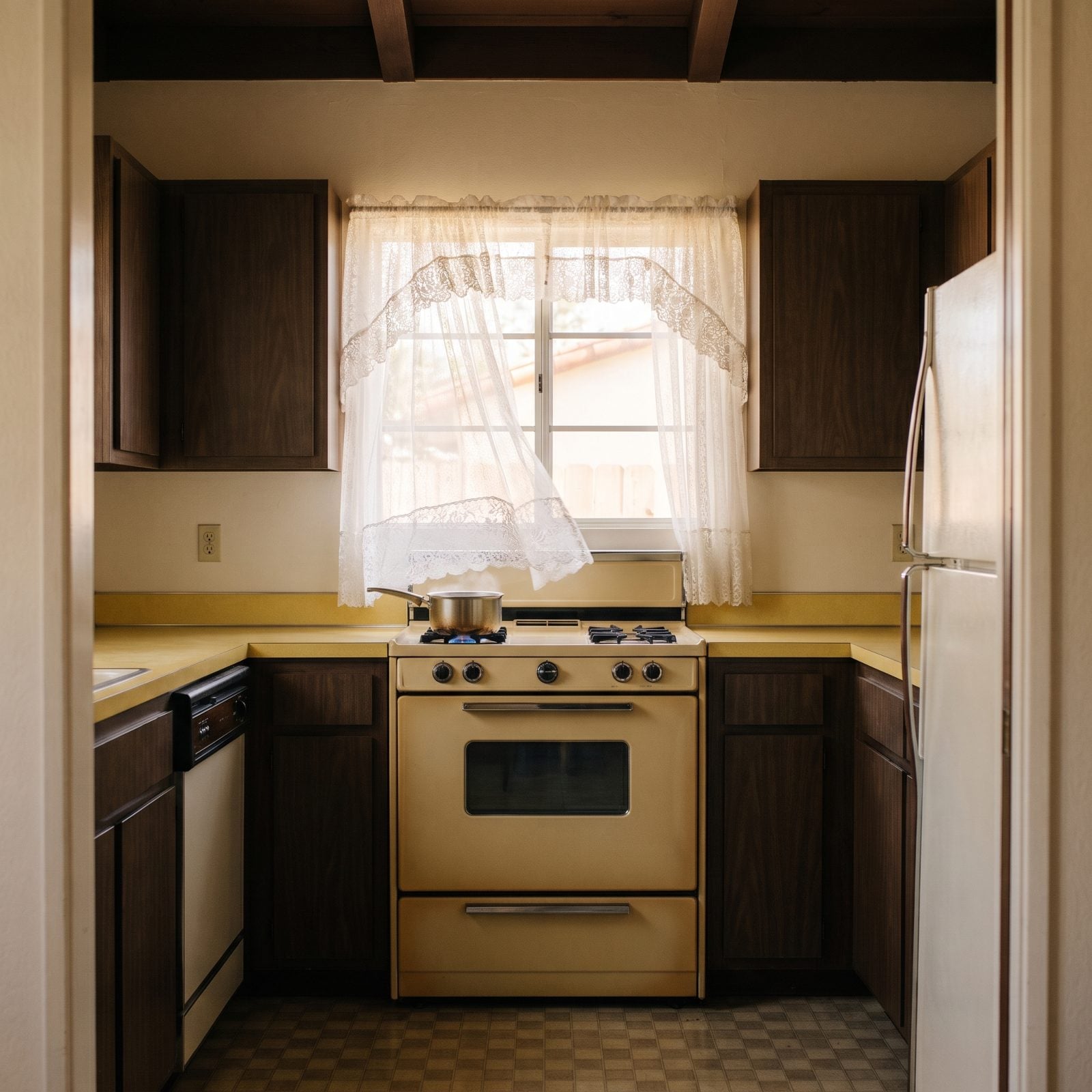 Lace Curtains Fluttering Inches From the Open Burners