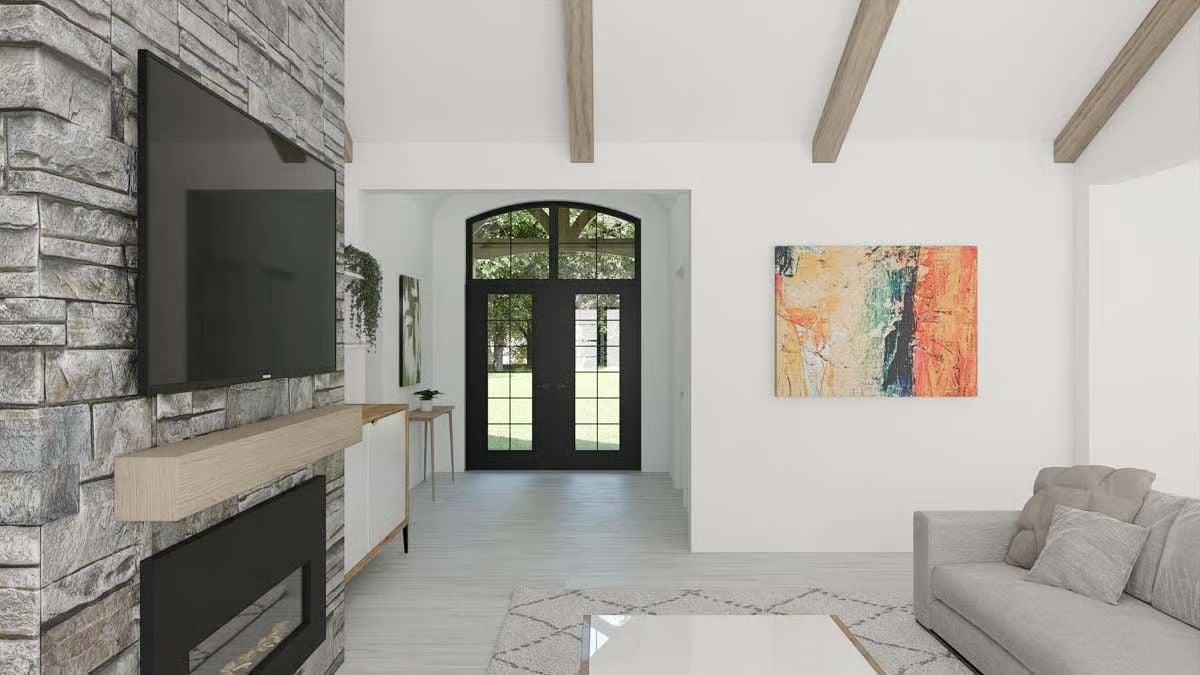 Exposed Beams Above a Stone Fireplace Wall That Actually Earns the Square Footage
