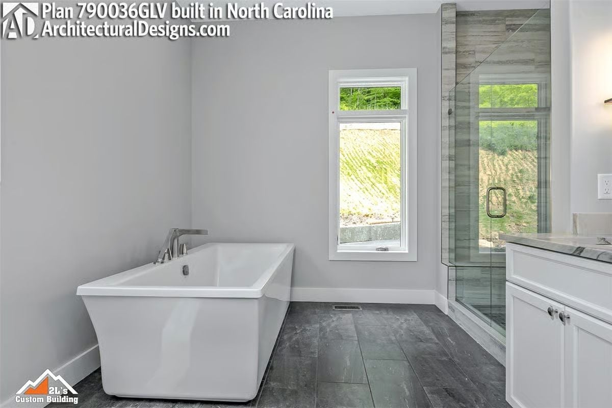 Freestanding Soaker Tub Positioned to Catch the View Right From the Water