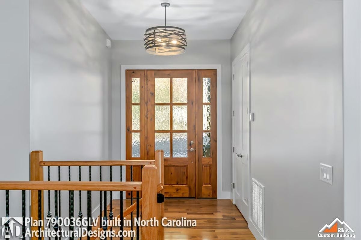 Warm Wood Entry with Iron-Wrapped Pendant and Sidelights