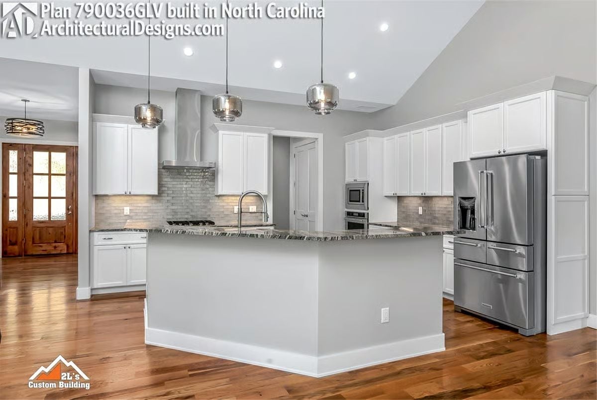 Waterfall-Edge Island and Chrome Pendants Make This Kitchen Feel Effortlessly Resort-Ready