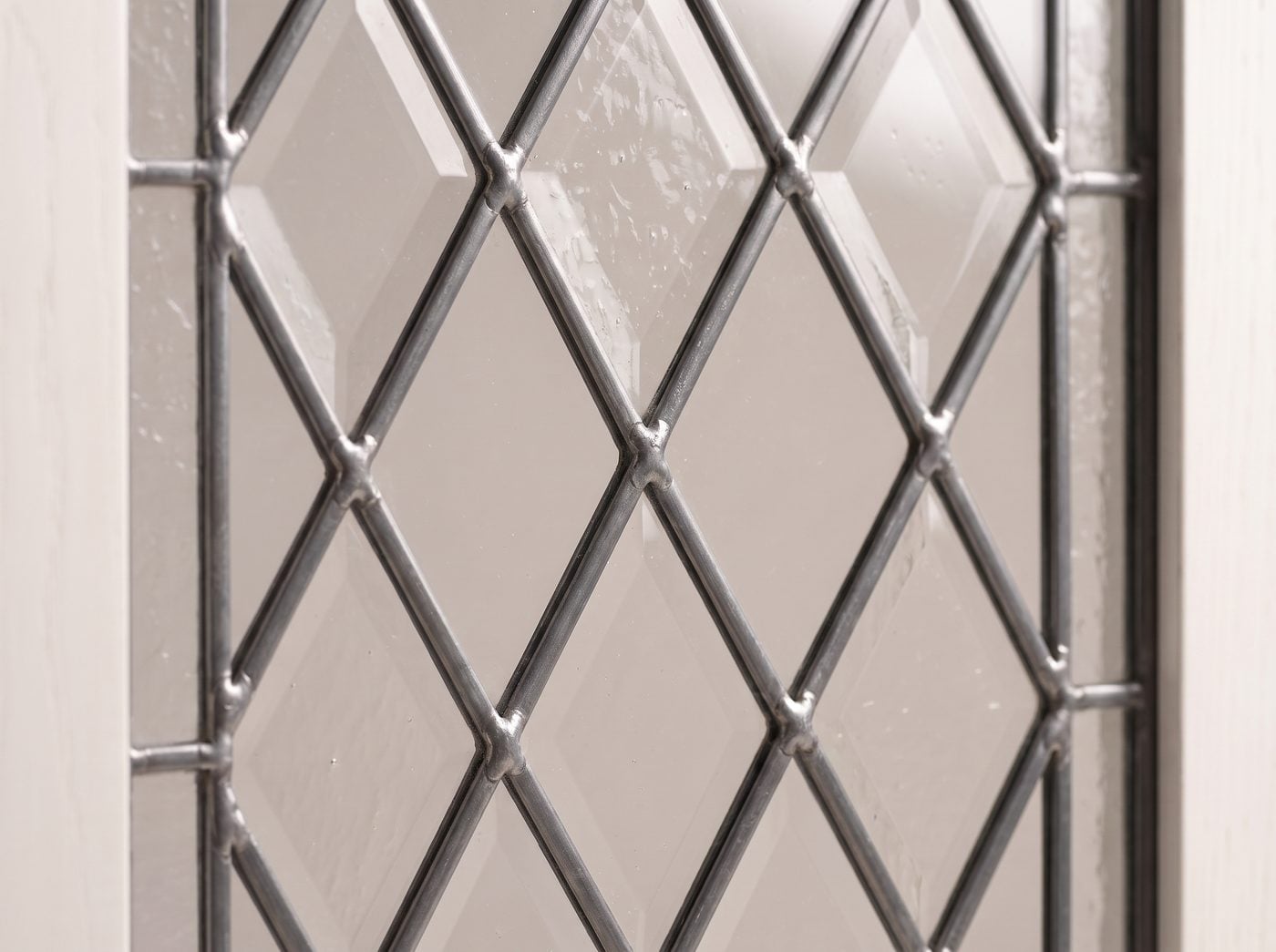 Leaded Glass-Front detail: lead cames forming a diamond lattice.