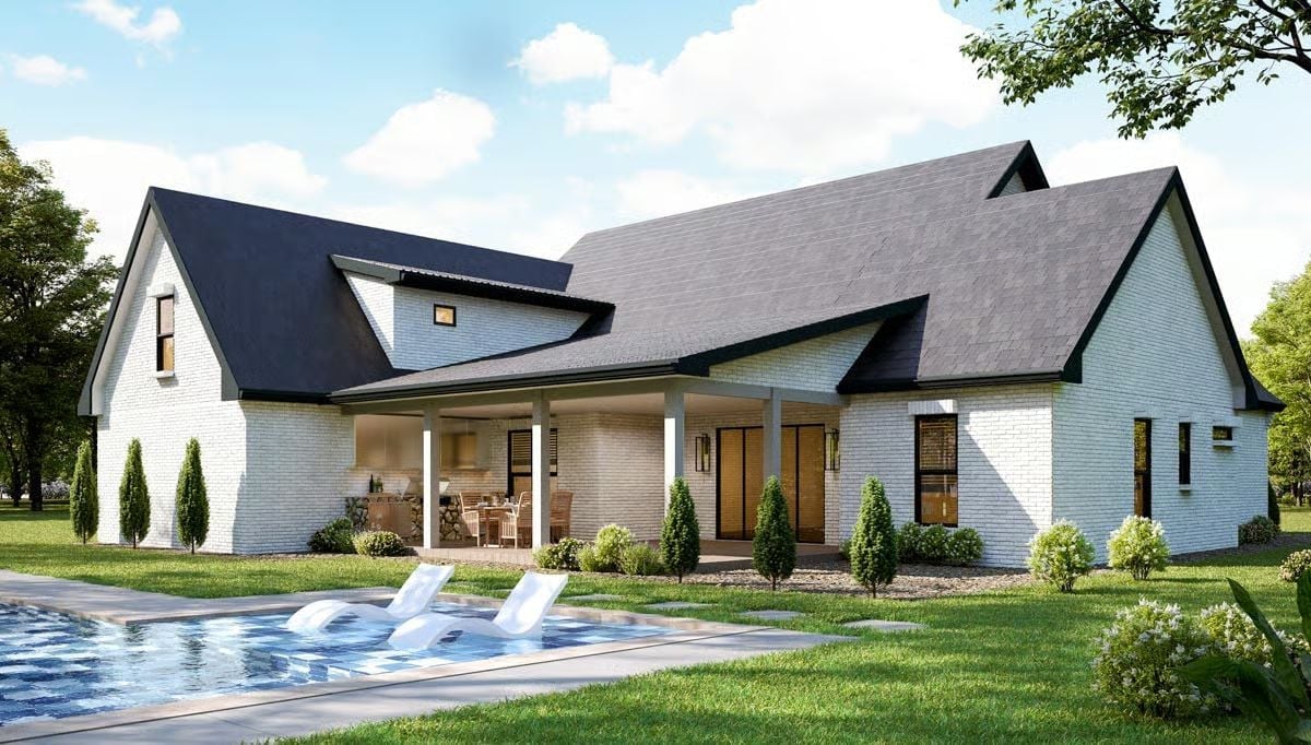 White Brick and Black Roof Define a Backyard Worth Gathering Around