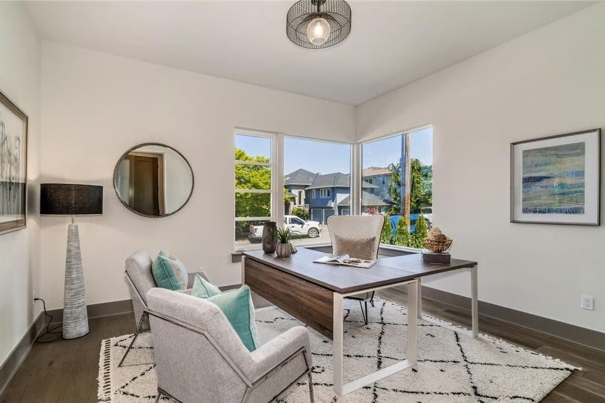 Corner Windows, a Leather-Front Desk, and Chairs That Invite You to Stay Awhile