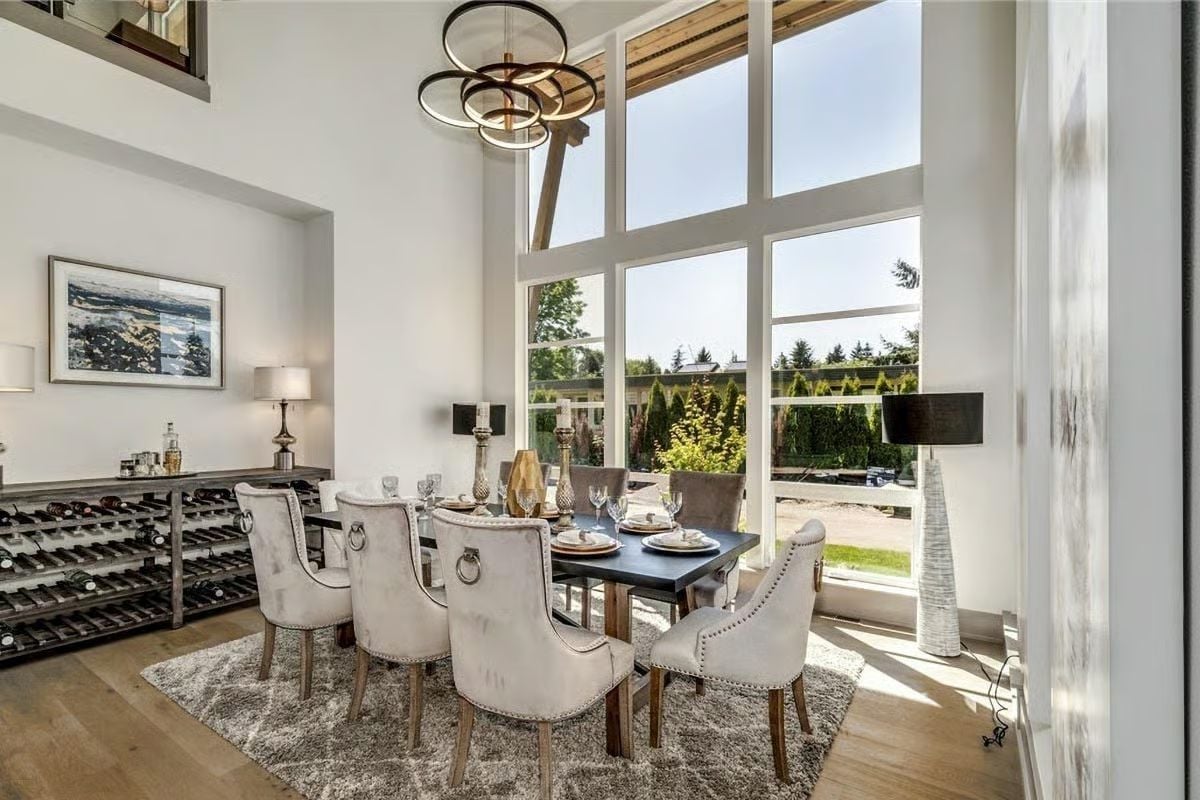 Velvet Chairs, a Wine Wall, and Floor-to-Ceiling Glass Make This Dining Room Hard to Leave